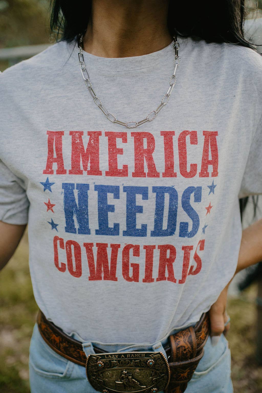 America Needs Cowgirls Graphic Tee